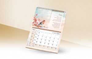 לוח שנה כסלו 2021, מאויר בציפור על ענף פרחוני.